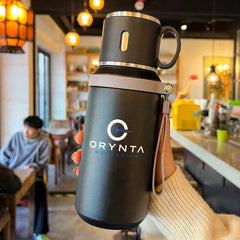 Black ORYNTA TRAVEL insulated travel bottle