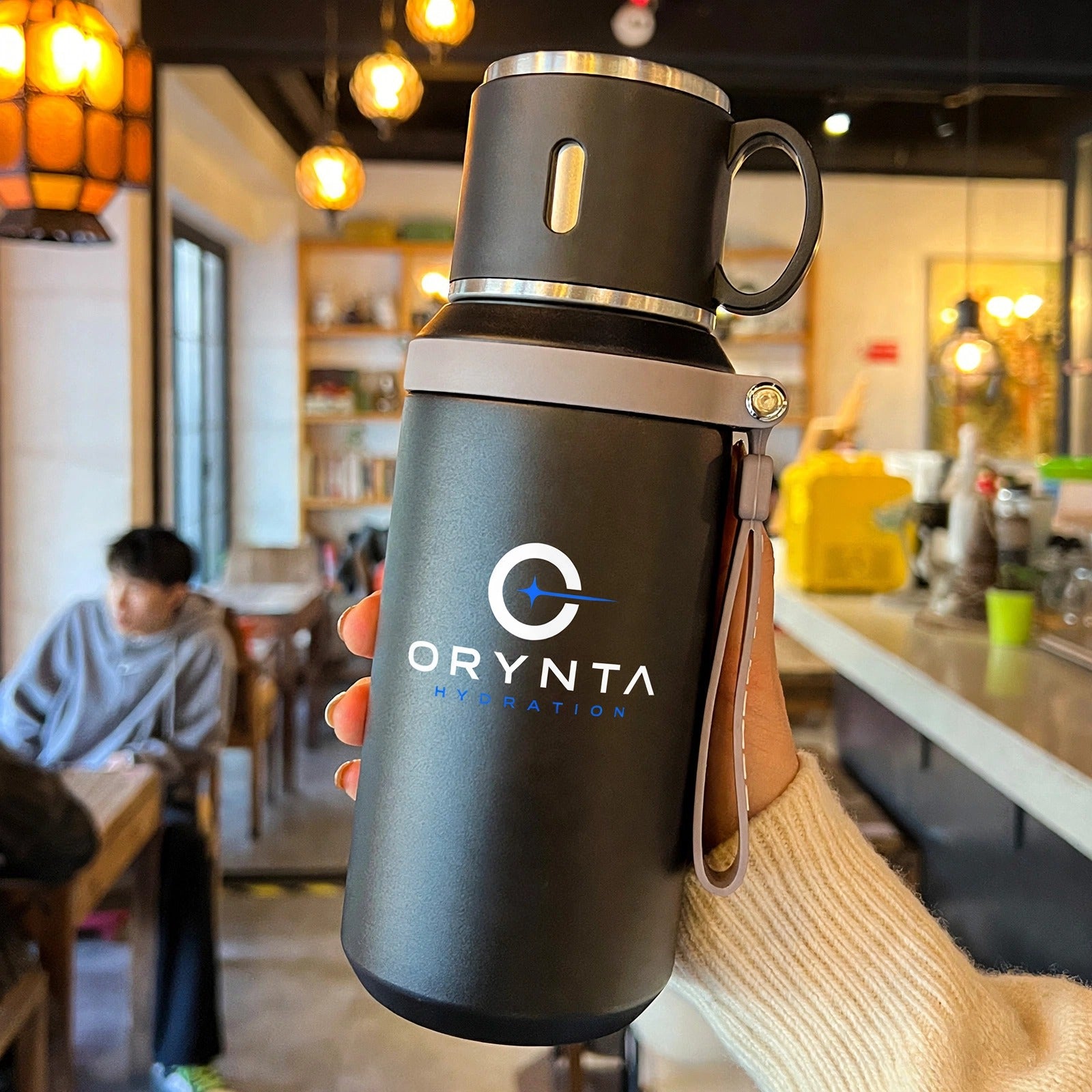 Black ORYNTA TRAVEL insulated travel bottle