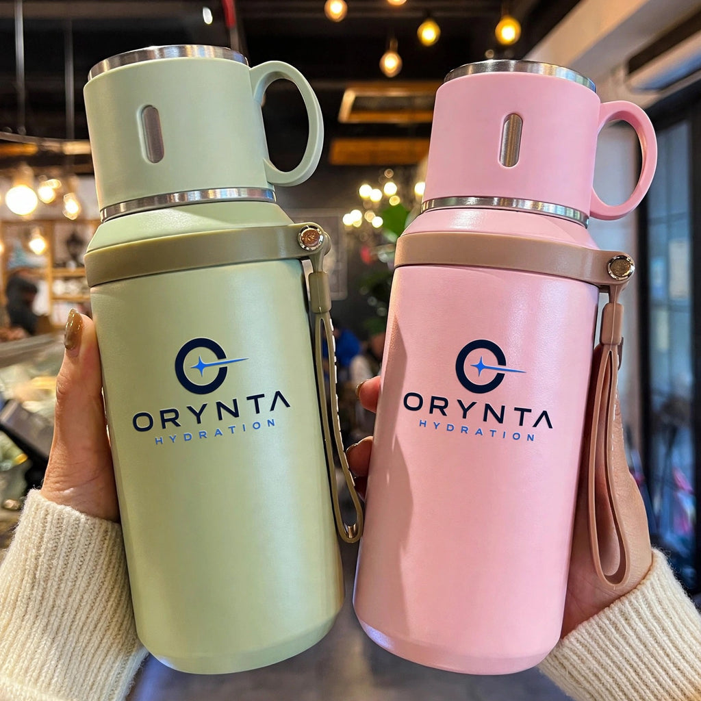 Green and pink ORYNTA TRAVEL insulated travel bottles